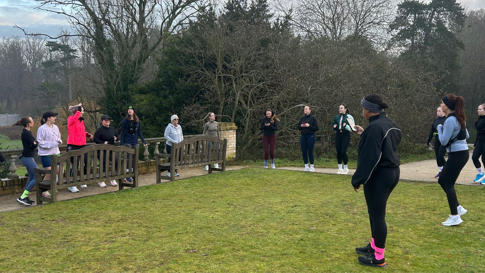 Group of female runners in a park.